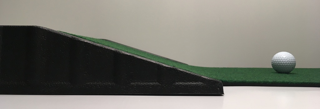A conventional gravity ramp for putting mats